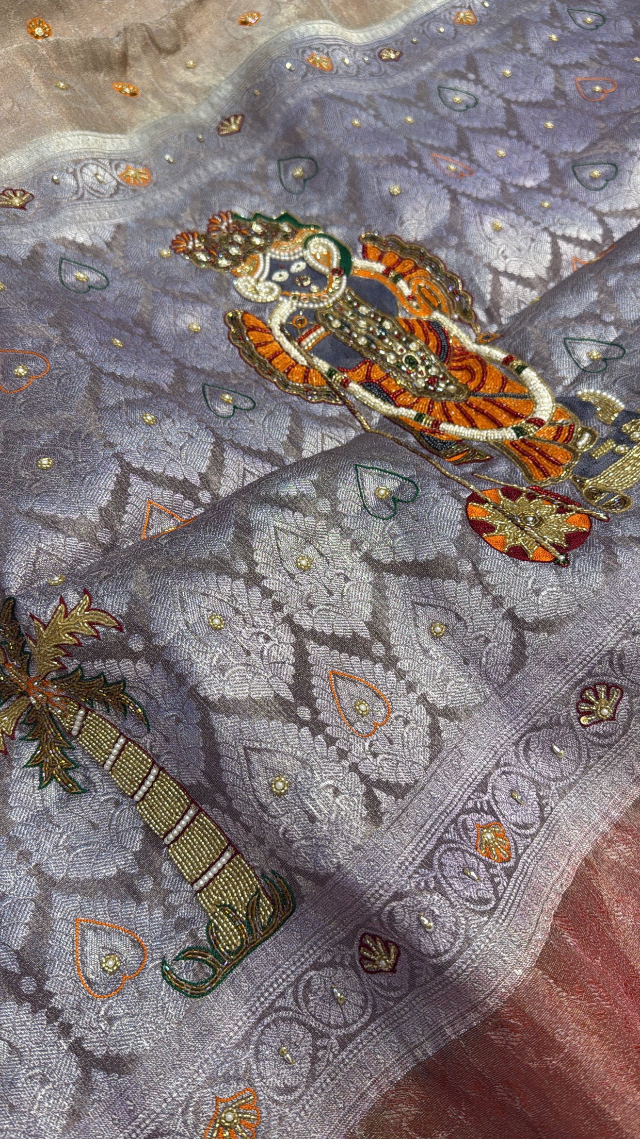 Dusty lilac tissue brocade shreenathji motif hand embroidered kadhwa saree